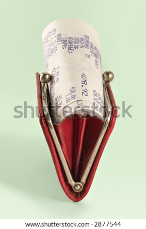Cash receipt on background of a purse-how to spend money without damage to the family budget