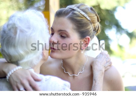 bride kisses family member