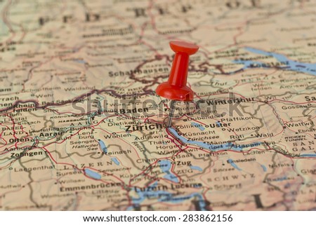 Zurich marked with red pushpin on map. Selected focus on Zurich and pushpin. Pushpin is in an angle.