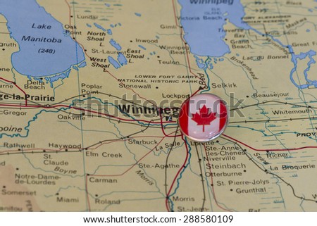 Winnipeg marked with national flag pushpin on map. Selected focus on Winnipeg and pushpin.