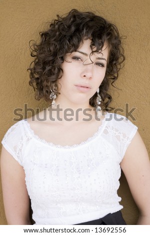 Girl with beautifully defined, naturally curly hair.