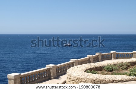 Blue Grotto Bay view in Malta island with boats and clear blue sea and sky background, Europe