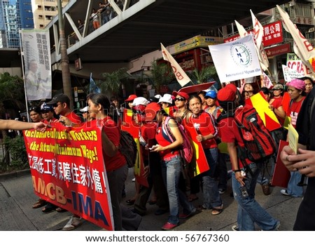 HONG KONG, CHINA - JULY 1: On an extremely hot day, thousand of people in Hong Kong participated in the annual march demand for minimum wage from the government on July 1, 2010 in Hong Kong.