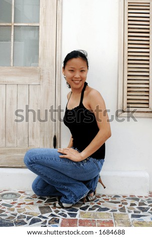 Korean woman crouching down