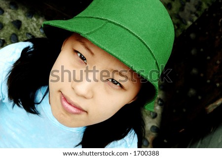 Fresh faced young Korean woman wearing a green hat