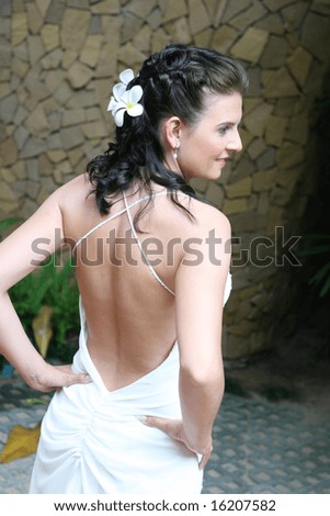 Beautiful young bride with flowers in her hair.