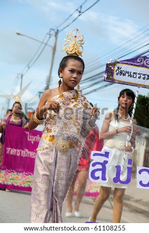 PHUKET - SEPTEMBER 16: unidentified students during a parade marking the birthday of monk  Luang Pu Supha who is 114 on September 16, 2010 in Phuket, Thailand. Many Thais believe he is the world\'s oldest man.