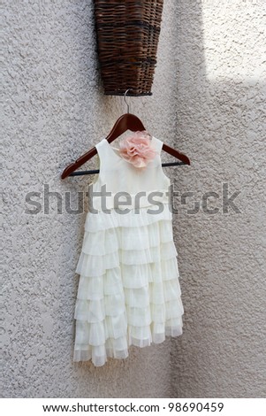 Pretty bridesmaid dress hanging up.