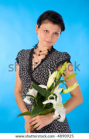 the young woman with madonna lily on blue background