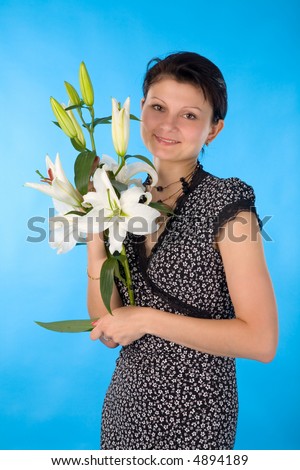 the young woman with madonna lily on blue background