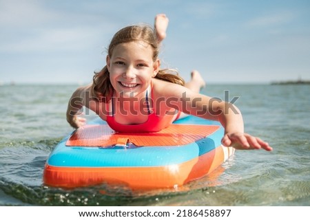 Similar – Foto Bild Mädchen auf einem Supermarkt am Ufer des Torre San Giovanni