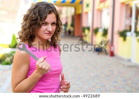 Angry wife threats her husband with mechanic key