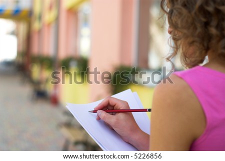 Businesswoman is preparing for annual report outdoors