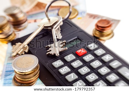 Money and keys. Cose-up pbjects on the white background.