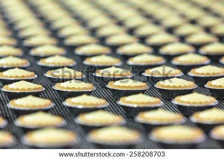 Pastry. Pastry on a conveyor. A lot of cookies.