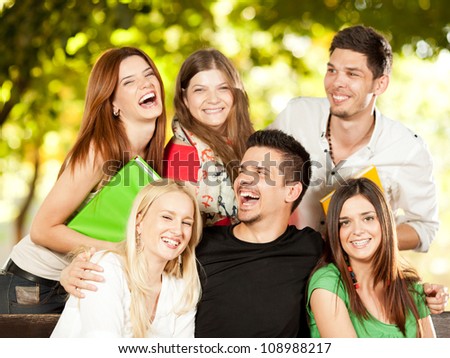 Young student friends laughing outdoors