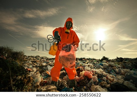 Recycling worker inspecting wastes according to landfill waste acceptance criteria.