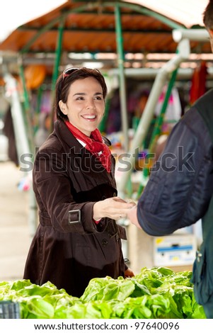 Woman buying at the green market
