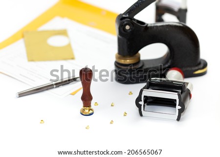 Notary public embosser, stamp, stapler. Selective focus.