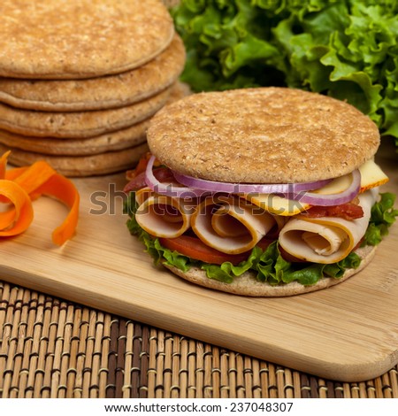 Healthy Turkey Sandwich on Whole Wheat Thin Sandwich Roll. Selective focus.