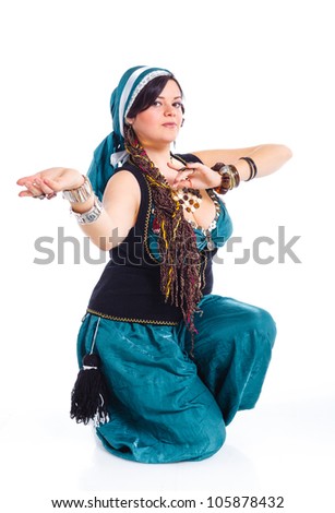 Oriental dancer in blue costume over white background
