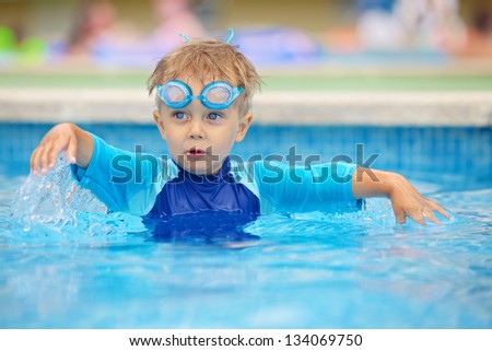 2 Year Old Kid Laughing In A Swimming Pool. Stock Photo 134069750 ...