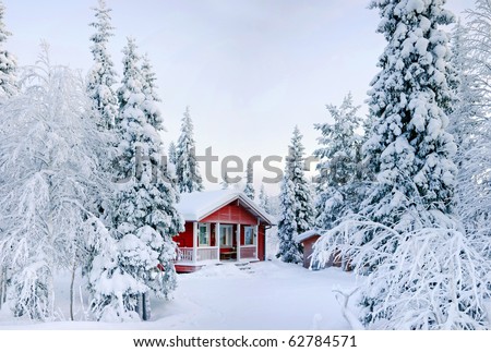 Winter\'s Tale. Red Finnish cottage in a beautiful snow forest.