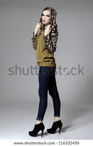 young casual man full body fashion woman posing on gray background