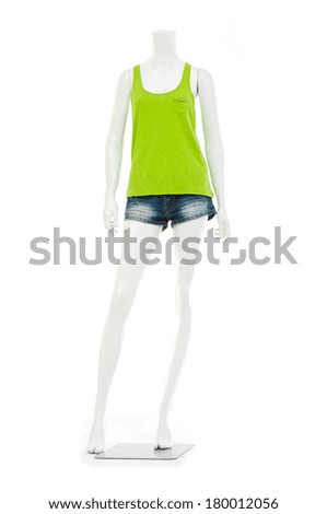 full-length female mannequin in trousers, jeans shorts and green shirt