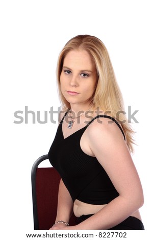 Model sitting with straight back on chair