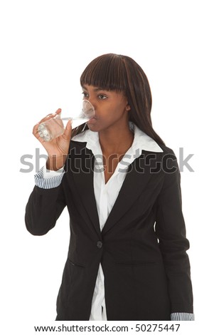 Young female black executive drinking fresh water out of a glass