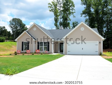 WINDER, GEORGIA, USA - JULY 24, 2015: Home construction is picking up at local counties in Georgia. Shown is a new model home at development in Winder, Georgia.