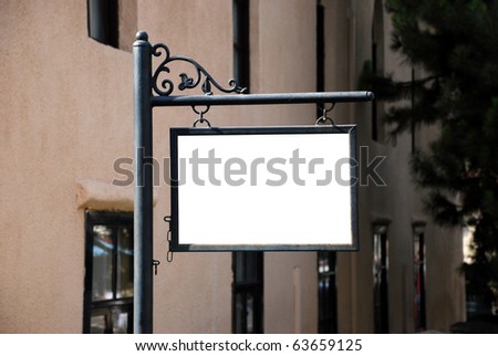 Blank white sign with a copy space area hanged from a pole