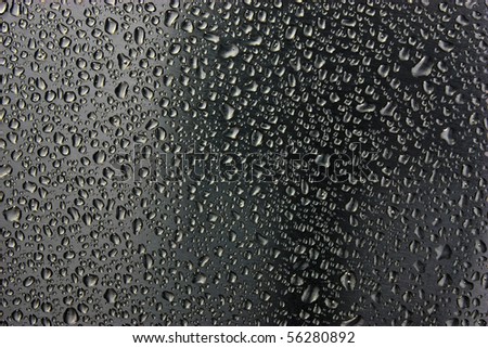 water drops on black metallic surface
