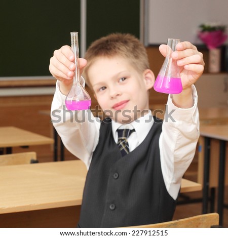 cute little boy with the pink chemical agent tubes, focus on the tubes