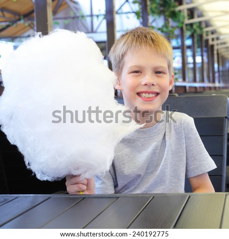 little boy with cotton candy