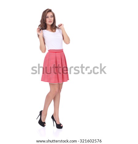 pretty young girl wearing red short striped skirt