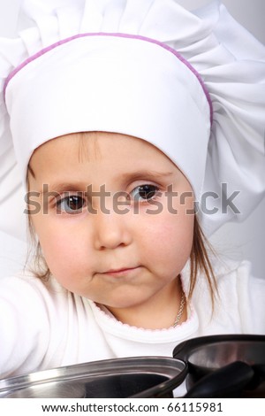 pretty little baby in a cook cap