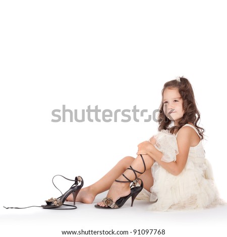 Little Girl Trying On The Big Shoes Stock Photo 91097768 : Shutterstock