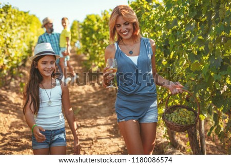Similar – Image, Stock Photo Winegrower and daughter with bucket of grapes in countryside