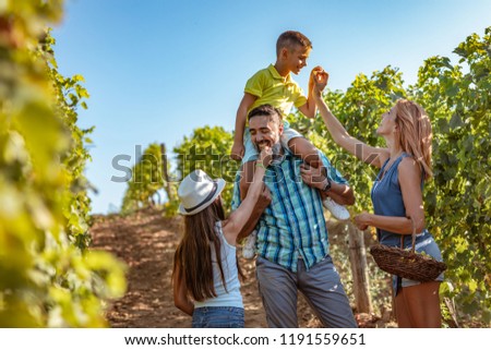 Similar – Image, Stock Photo Winegrower and daughter with bucket of grapes in countryside