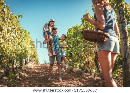 Similar – Image, Stock Photo Winegrower and daughter with bucket of grapes in countryside