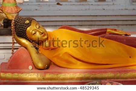 buddhist statue lying