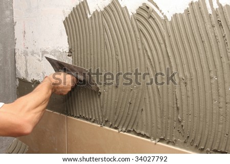 details of trowel spreading mortar for ceramic tile