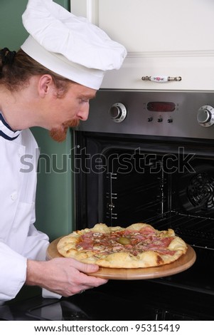Young chef prepared italian pizza in kitchen