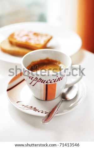 Cup of coffee and toasts