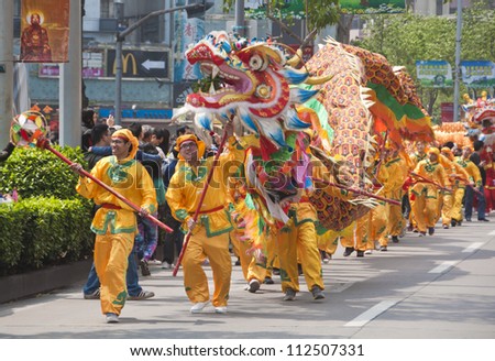 FOSHAN, MARCH 23: Dragon Dance In The Parade To Celebrate The Birthday Of The temple Of God, Foshan Temple Organized A Parade Of The Intangible Cultural Heritage March 23, 2012 in Foshan, China