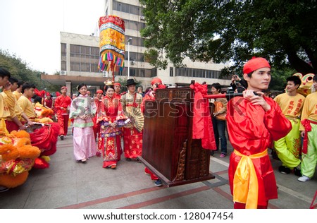 FOSHAN CITY - FEB 2: Foshan City to celebrate the Chinese new year organized Carnival activities, Chinese traditional wedding procession at the parade in February 2, 2012 in Foshan, China