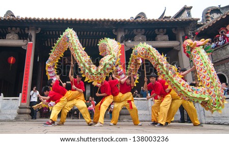FOSHAN CITY-MARCH 22:In 2013 the dragon dance competition held in Foshan ancient house, pictures of the Nanhai dragon dance team in the show March 22,2013 in Foshan,China