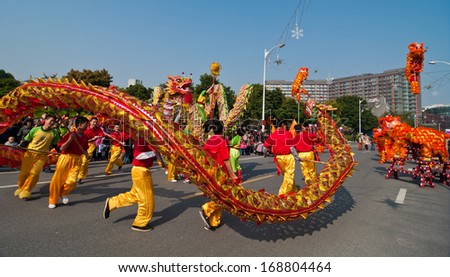 FOSHAN CITY-Â?Â?Dec 21: In order to meet the 2014 new year, dragon dance and lion dance teams performed at the Foshan square,attracted a large number of people to watch Dec 21, 2013 in Foshan, China